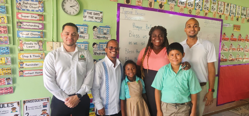 Minister Bernard speaking with students